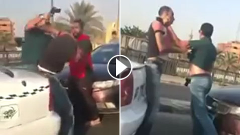ضابط شرطة يعتدي على سائق بسلاحه الناري ويضربه على رأسه