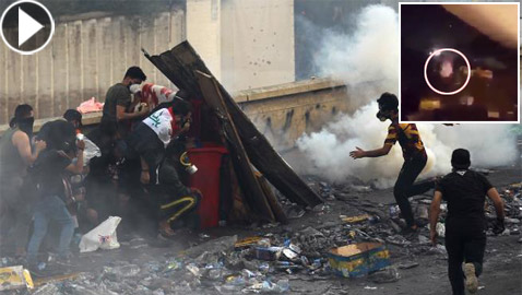 بكاميرا هاتفه.. متظاهر عراقي يوثق لحظة إصابته في كربلاء! فيديو