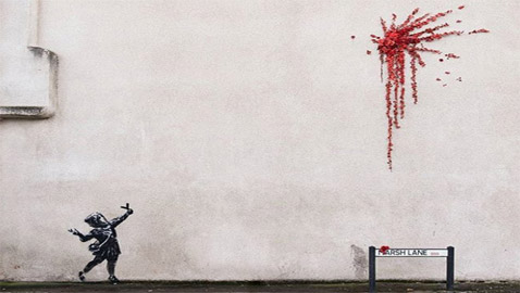 رصاصة من الزهور.. (غرافيتي) بانكسي الجديدة بمناسبة عيد الحب